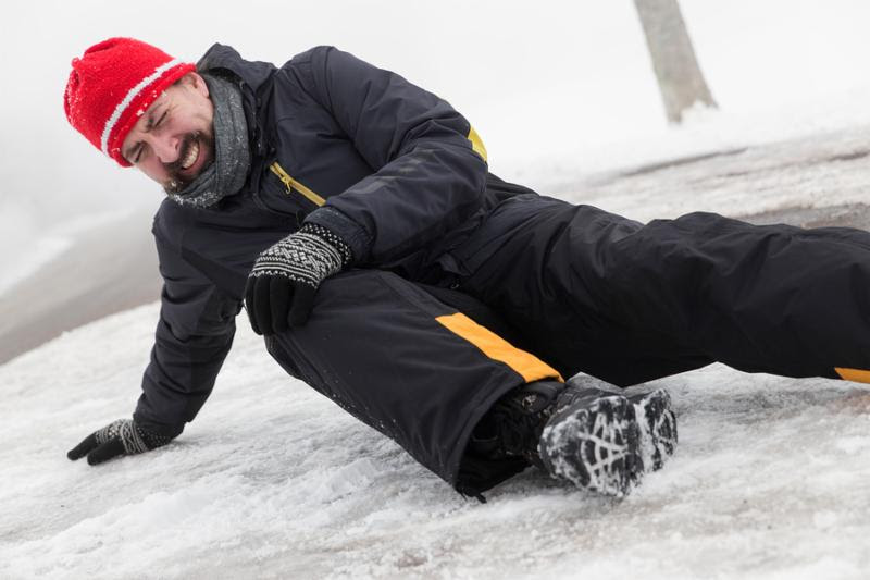 man falls on ice